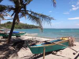Traditional outrigger boats on the beach at Lutoban Marine Protected Area