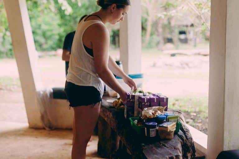 A volunteer helping herself at the breakfast table on the MCP base