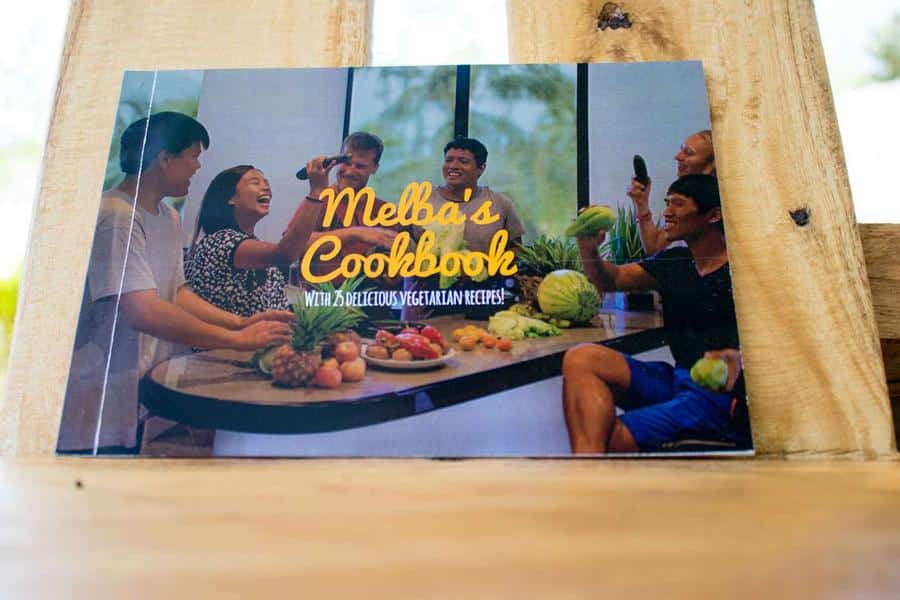 The cover of Melba's Cookbook, propped up on a wooden table