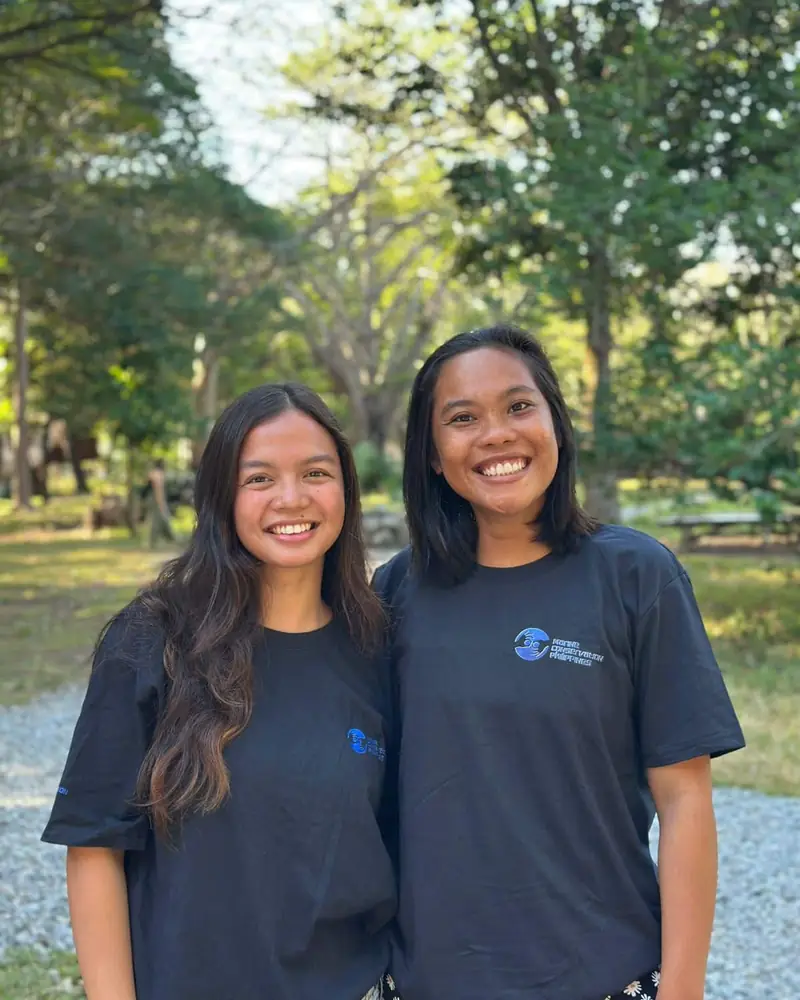 MCP scholars Elyssa and Fatim smiling beside one another